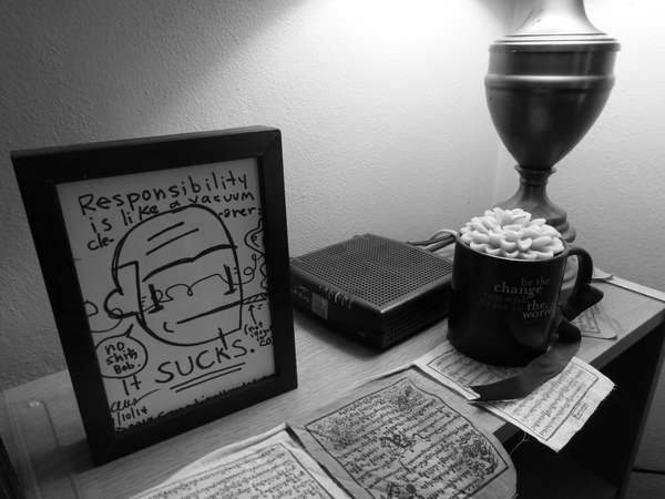 Self-portrait by Gregg Lion-Hands Symons; mug and candle from Jenn Weinzerl-Binus